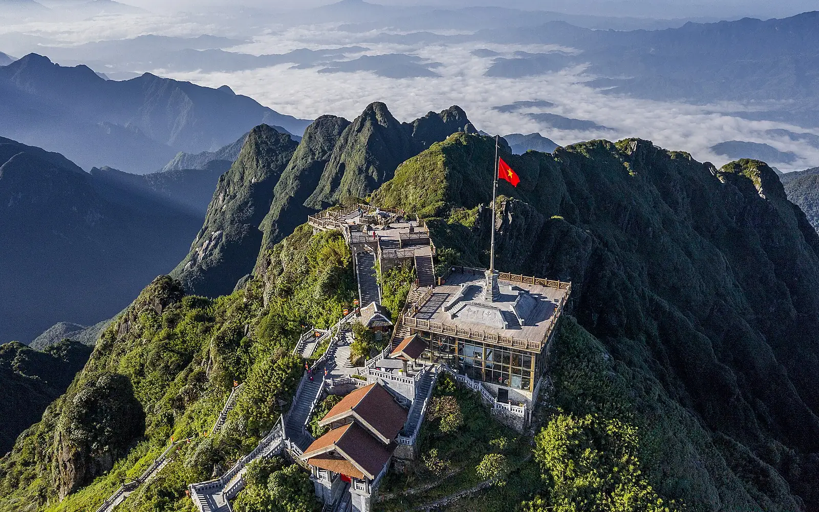 Fansipan Summit 3143m aerial wide temple complex sea of clouds Sa Pa Vietnam