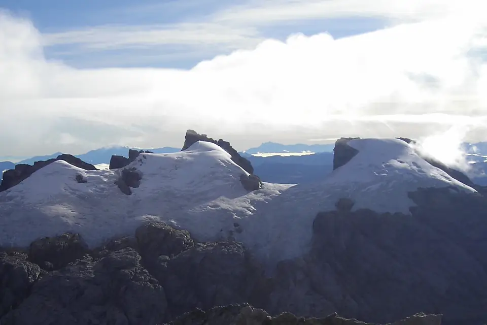 Sumantri (center) with Ngga Pulu (right) from Carstensz Summit by Christian Stangl flickr